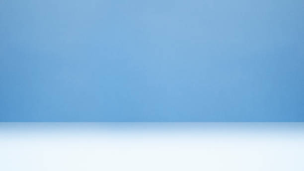 istock Clear empty photographer studio background abstract, background texture of beauty light clear blue, cold gray, snowy white gradient flat wall and floor in empty spacious room winter interior 1446773843