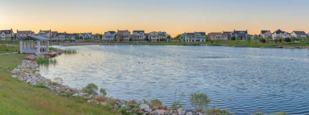 istock Oquirrh Lake with covered dock and surrounded by grass at Daybreak, Utah 1446777295