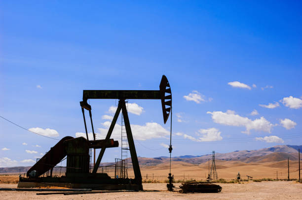 istock Oil Pumpjacks with Clouds in Background 1446781544