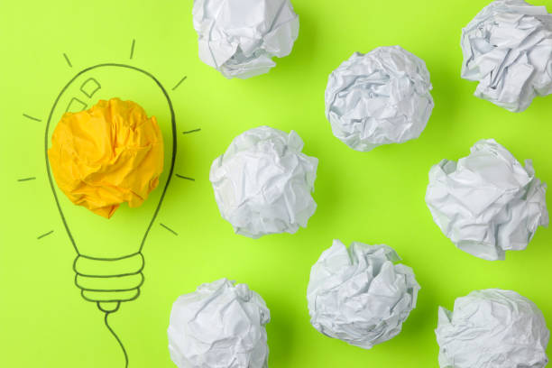 istock Concept creative idea. concept of creative idea. Crumpled paper balls and painted light bulb on bright background. metaphor, inspiration. 1446782760