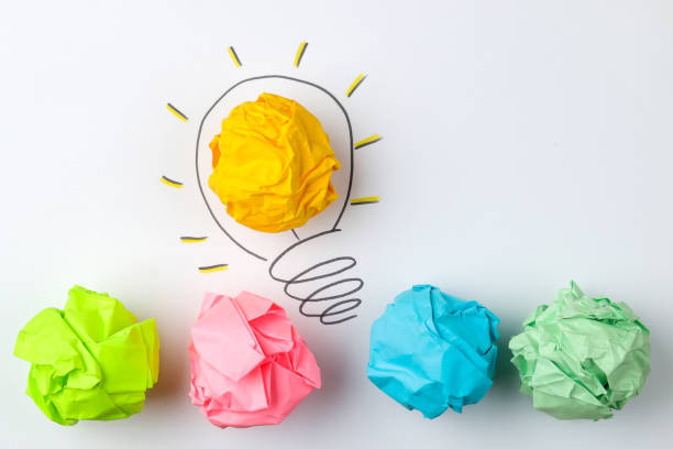 istock Concept creative idea. concept of creative idea. Crumpled paper balls and painted light bulb on bright background. metaphor, inspiration. 1446782778