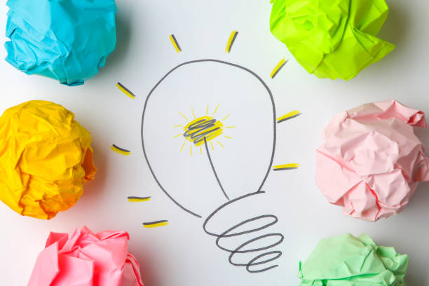 istock Concept creative idea. concept of creative idea. Crumpled paper balls and painted light bulb on bright background. metaphor, inspiration. 1446783183