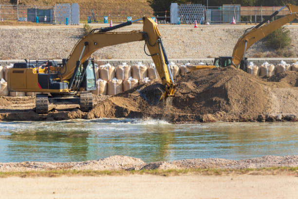istock Hydraulic excavator for dredging work in the river 1446784309