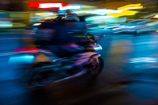 Blurred motion : Motorcyclist at full speed
