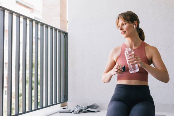 istock Woman Drinking Water After A Training 1446786156