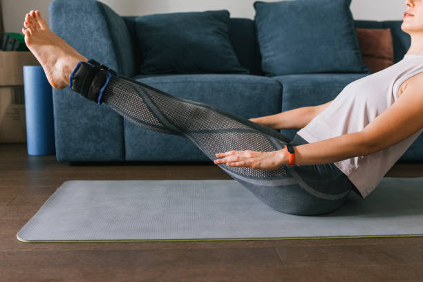 istock Woman Exercising At Home 1446786178