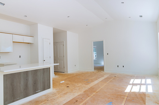 White kitchen cabinet installation in newly constructed house was carried out by contractor
