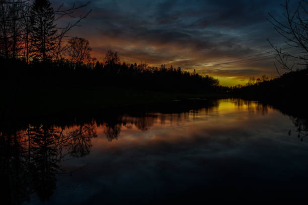 istock Scenic view of lake against sky at sunset 1446796648