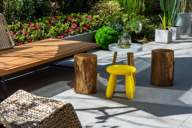 Sunny garden of modern house, stool