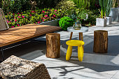 istock Sunny garden of modern house, stool 1446797948