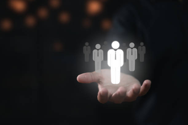 istock change agent concept of transformational leaders, transforming organizations to success, thinking processes, and analyzing business leaders. A businessman holds a human icon 1446804869