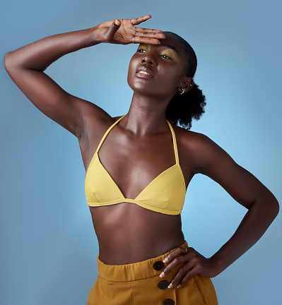 Makeup, fashion and black woman for summer, cosmetics or clothes with blue studio background mock up. Young, gen z african or Kenya girl model with proud and empowerment beauty for advertising mockup