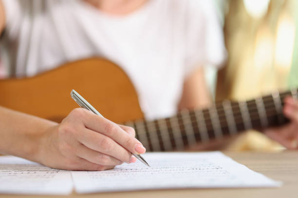istock Female hand writing notes of new song 1446809840