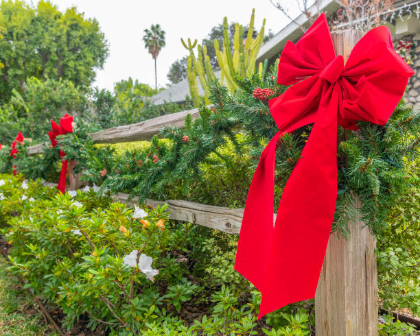 istock Christmas Wreaths on a Fence 1446809903