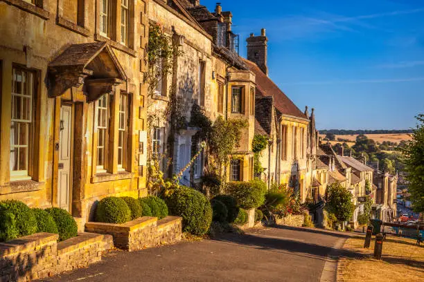 Row houses along a road in he Cotswold village of Burford