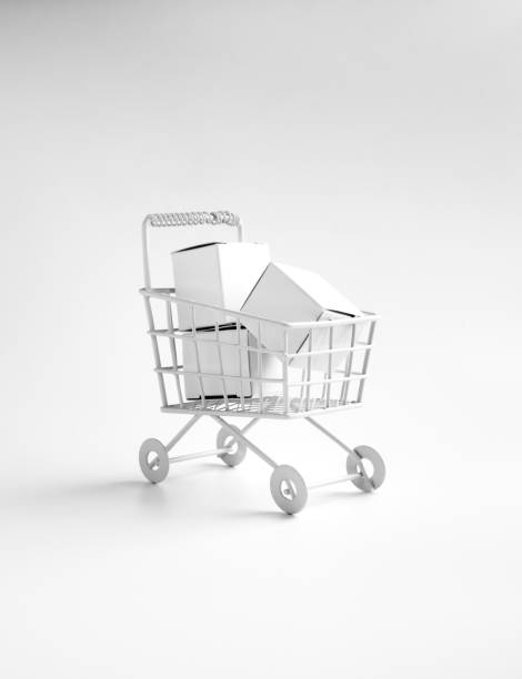 istock Shopping online business, e-commerce, delivery, purchasing power concepts. White parcel boxes in shopping trolley cart supermarket isolated on white background, vertical, minimal style. 1446813212