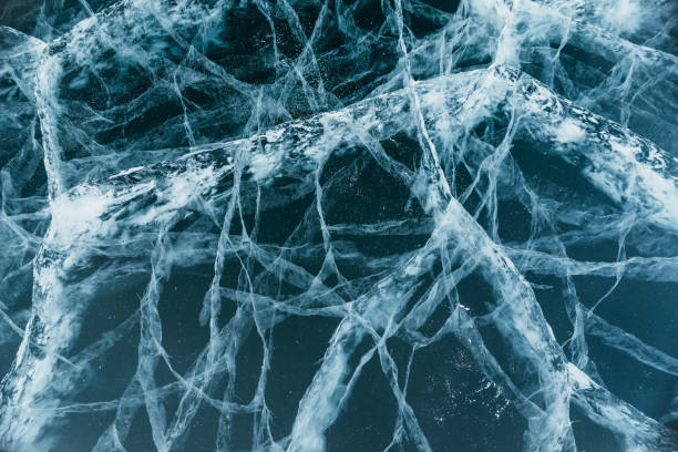istock The beautiful Baikal ice with magical cracks before your eyes. This is really cool. The camera moves down the ice. Extreme close-up view 1446815701