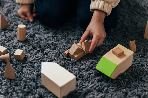istock Little boy playing wooden toys 1446820865