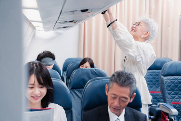 istock Elderly passenger removing carry-on luggage 1446821876