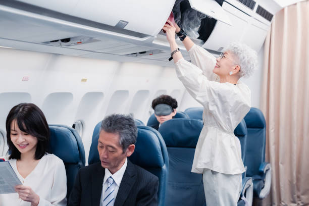 istock Elderly passenger removing carry-on luggage 1446821881
