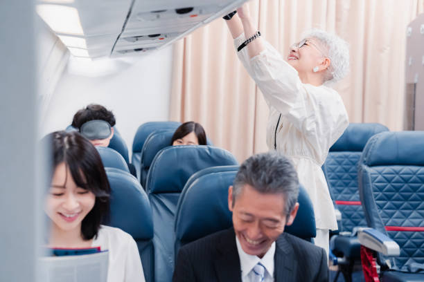 istock Elderly passenger removing carry-on luggage 1446821883