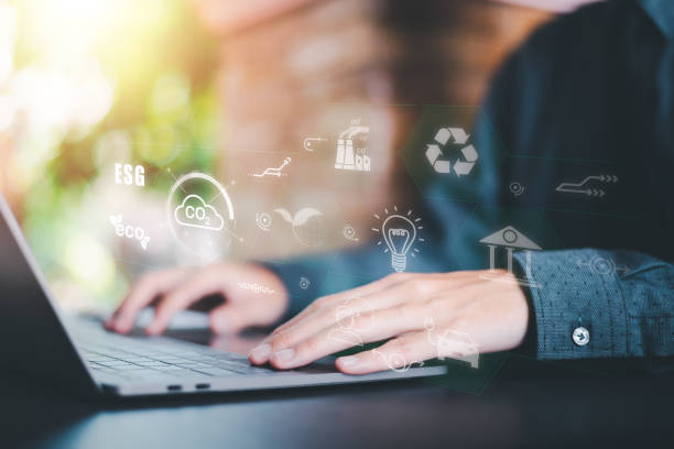 istock protecting the environment alternative energy Sustainable renewable energy sources Green energy innovation and environmentally friendly energy technology,Ecologist checking work on laptop 1446822976