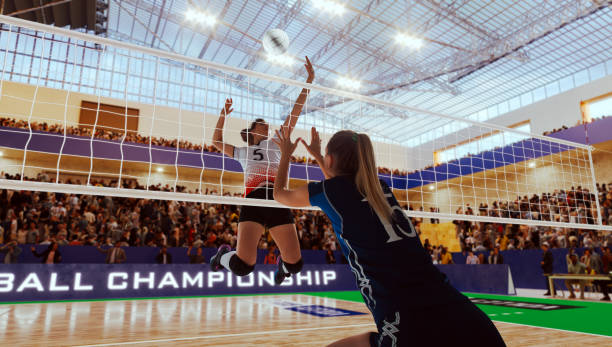 jogadoras de voleibol feminino em ação no estádio profissional. - high jump fotos - fotografias e filmes do acervo