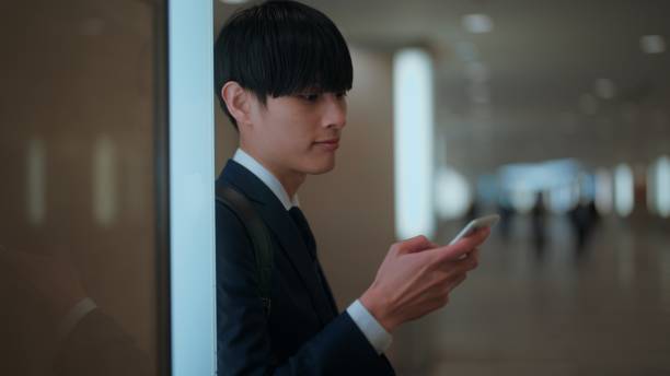 istock Businessman using smart phone in city 1446824093