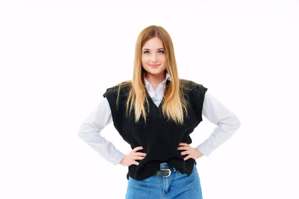 istock a blonde with sequins on face in a black knitted vest on a white background. 1446828342