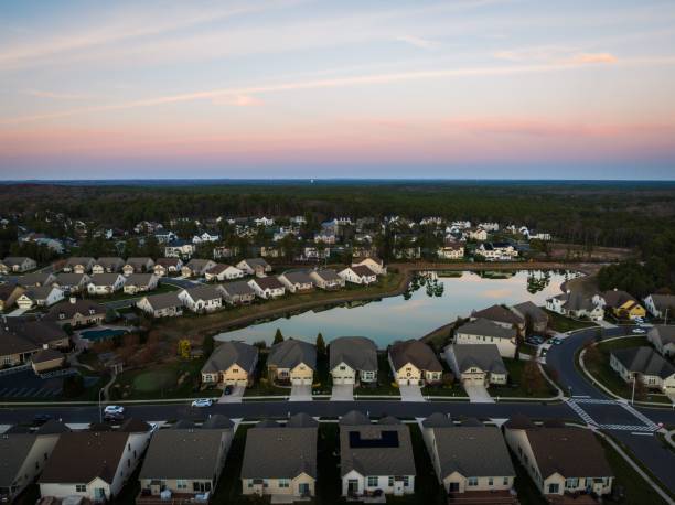 Aerial view of a typical American residential area in New Jersey at sunset An aerial view of a typical American residential area in New Jersey at sunset cherry hill nj stock pictures, royalty-free photos & images