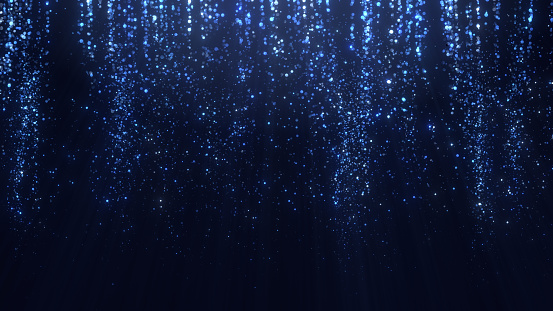 Glittering Christmas particles background in blue