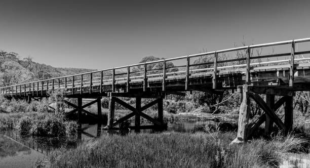An Old Wooden Bridge crossing a river in the Australian Alps