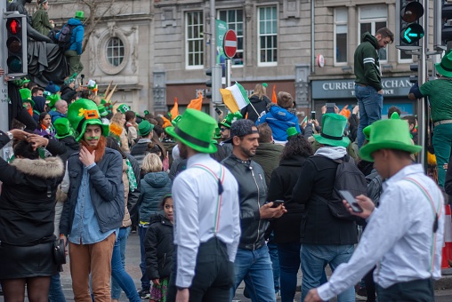 Dublin, Ireland – March 18, 2019: The people dressed up in green for saint Patrick's day in Ireland, Dublin City center