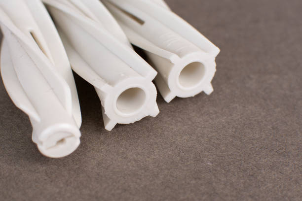 White dowel for foam concrete on a gray background.