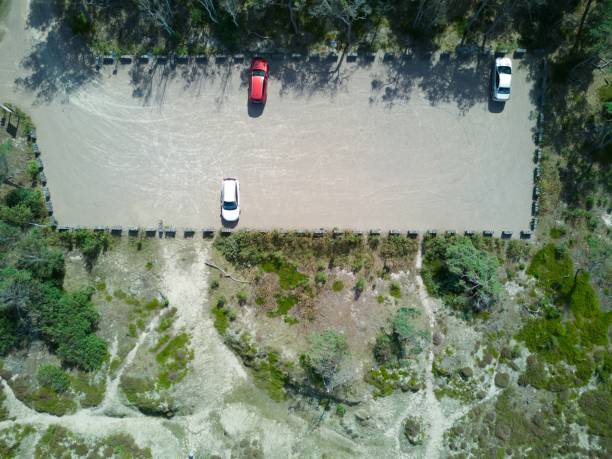 istock Aerial drone image of a parking spaces 1446834513