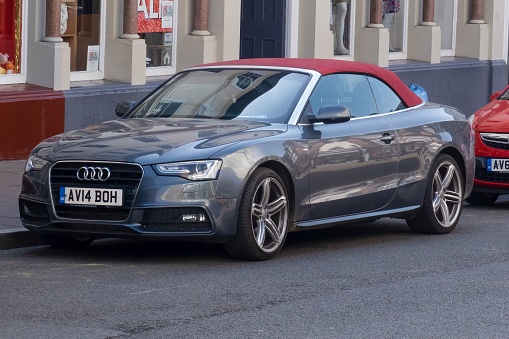 Bury St Edmunds, United Kingdom – July 18, 2022: A Grey 2014 Audi A5 Cabriolet high performance car parked in street