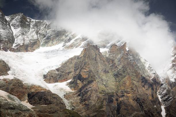 istock Majestic rocky formation with glacier under the clouds 1446835069