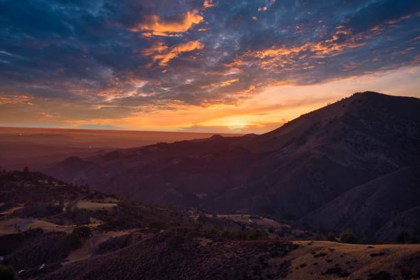 istock View of mountain slopes - geological formations under the cloudy sunset sky 1446835850