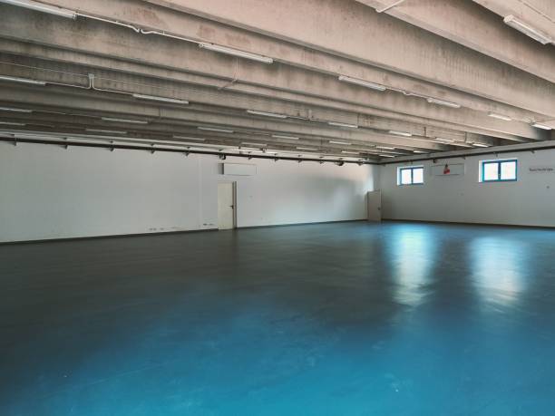 istock Big empty area with a few small windows and two enter doors - planned as gym 1446836415