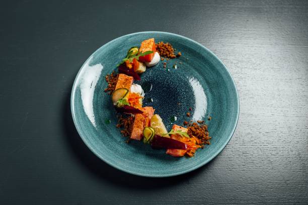 istock Fresh and beautiful slow cooked salmon on dark blue background 1446839355