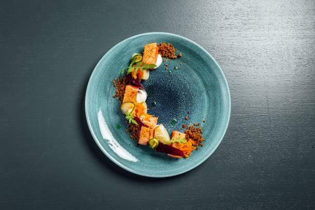 istock Fresh and beautiful slow cooked salmon on dark blue background 1446839363