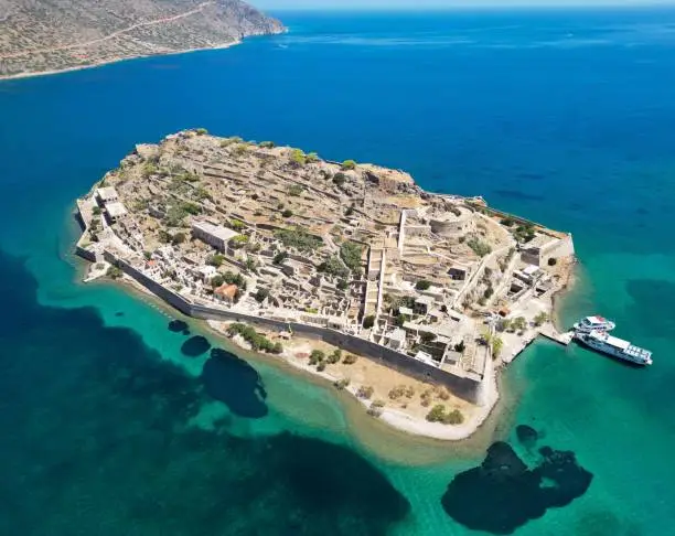 An aerial view of the fortress on the island of Spinalonga with calm sea