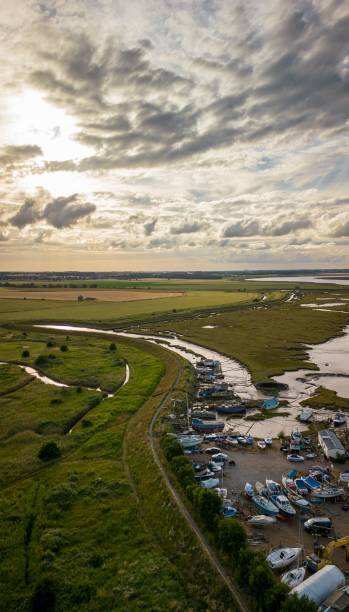 istock Vertical aerial view of a shipping port surrounded by fields 1446842821