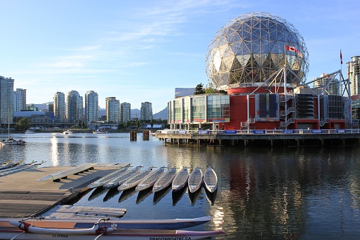 Vancouver, Canada – June 25, 2022: The Science World museum building before the False Creek under the blue sky in Vancouver