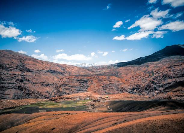istock Aerial view of valley between red arid rocks on blur sky background 1446844615