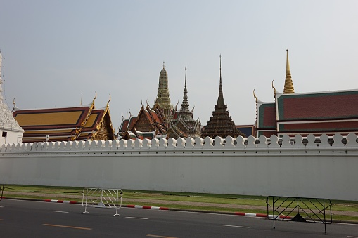 The Temple of the Emerald Buddha behind the white fence