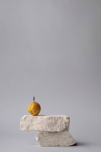 istock Pear on the stones isolated on grey background 1446845542