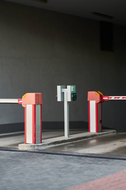 istock White and red gate arm at modern parking area 1446846128