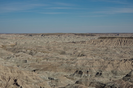 A desert area of rocky badlands under the blue sky