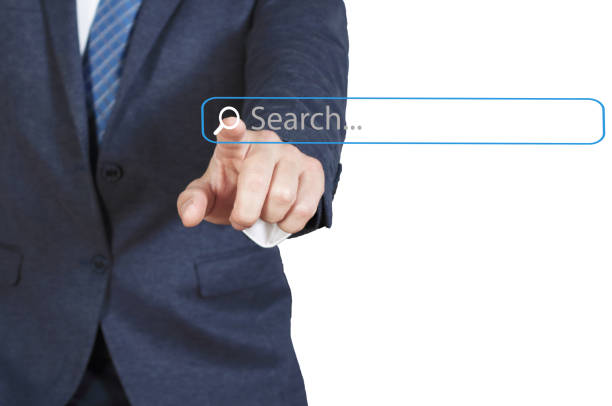 Businessman Touching Magnifier Icon In Search Box on virtual screen , Internet technology concept